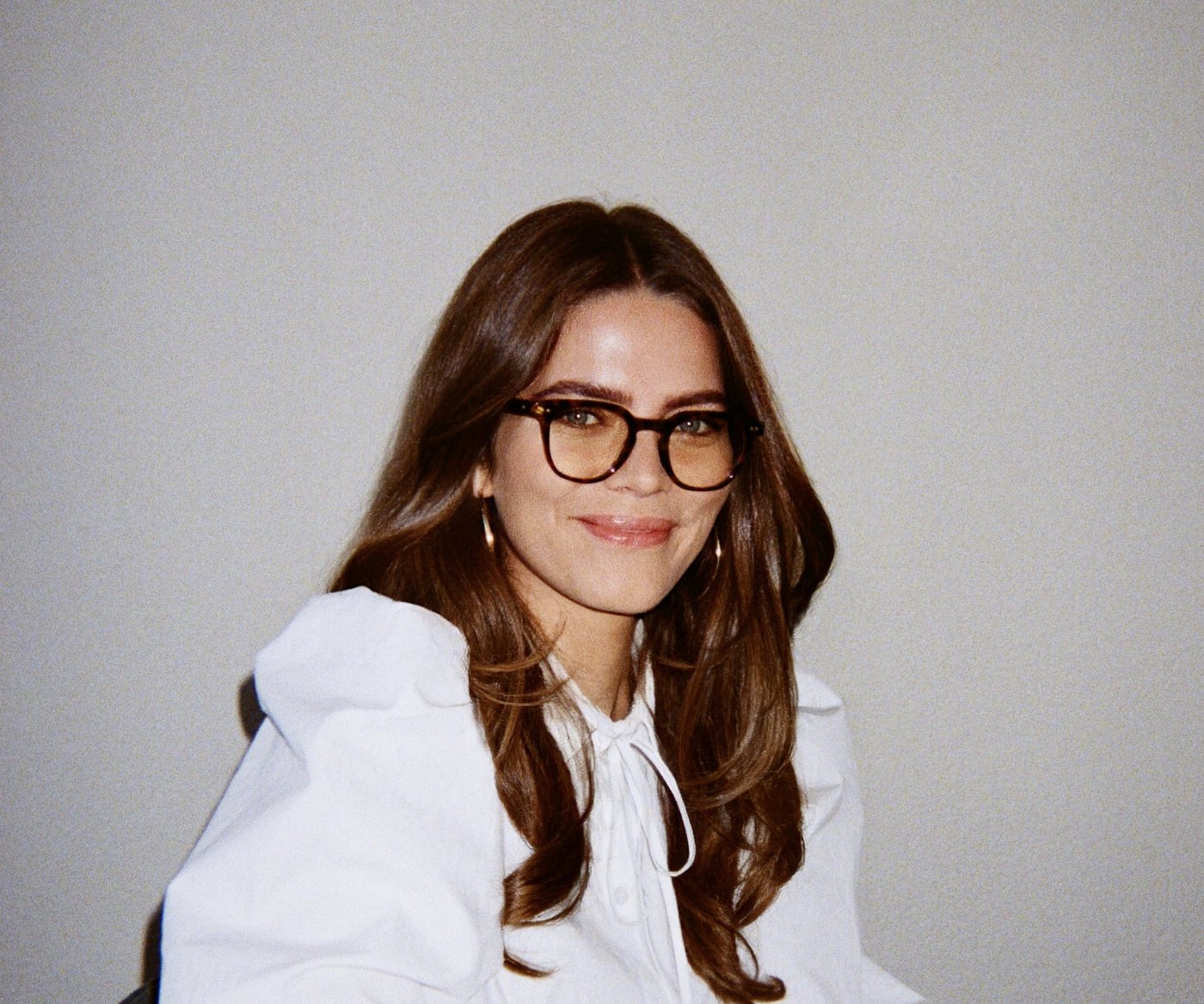 Young professional with glasses at a table