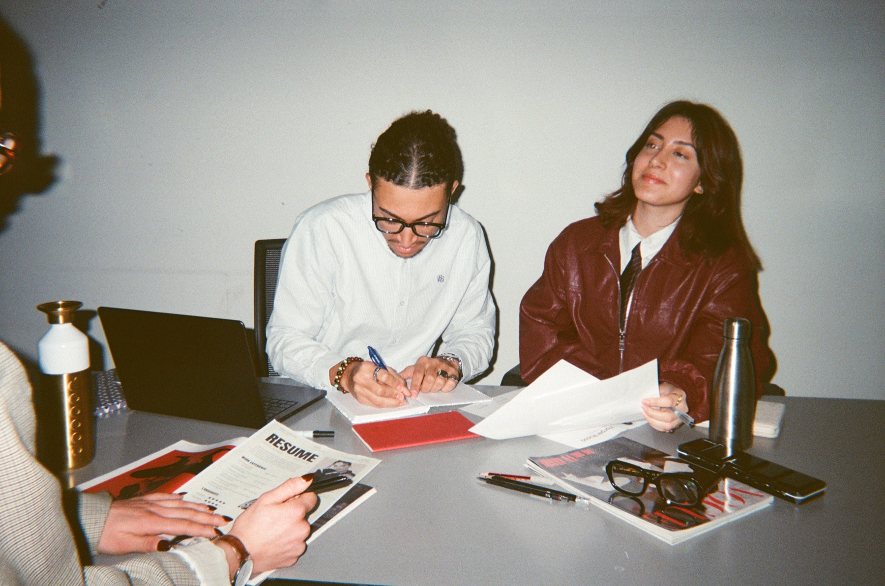 Two colleagues working together at a table