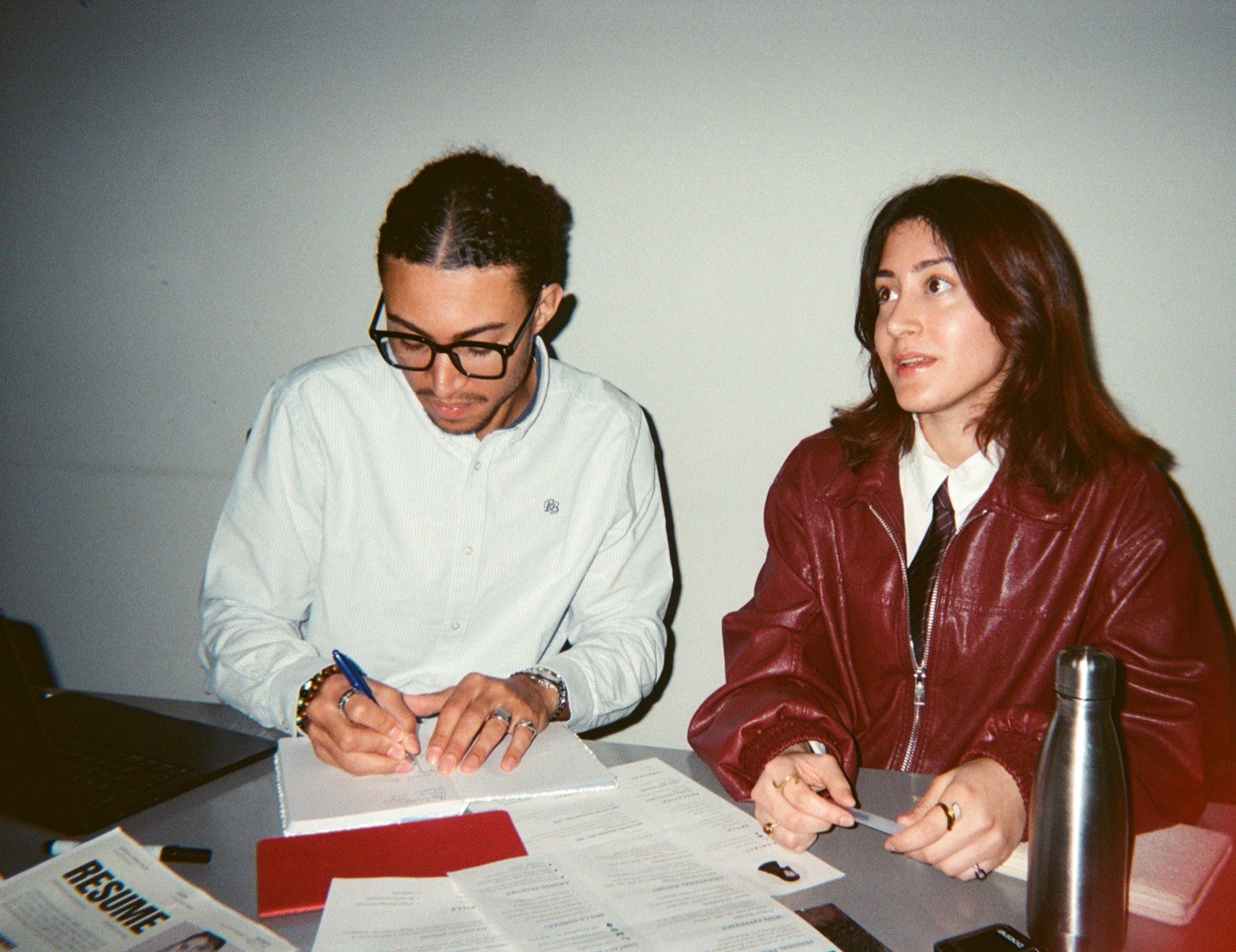 Two colleagues working together at a table