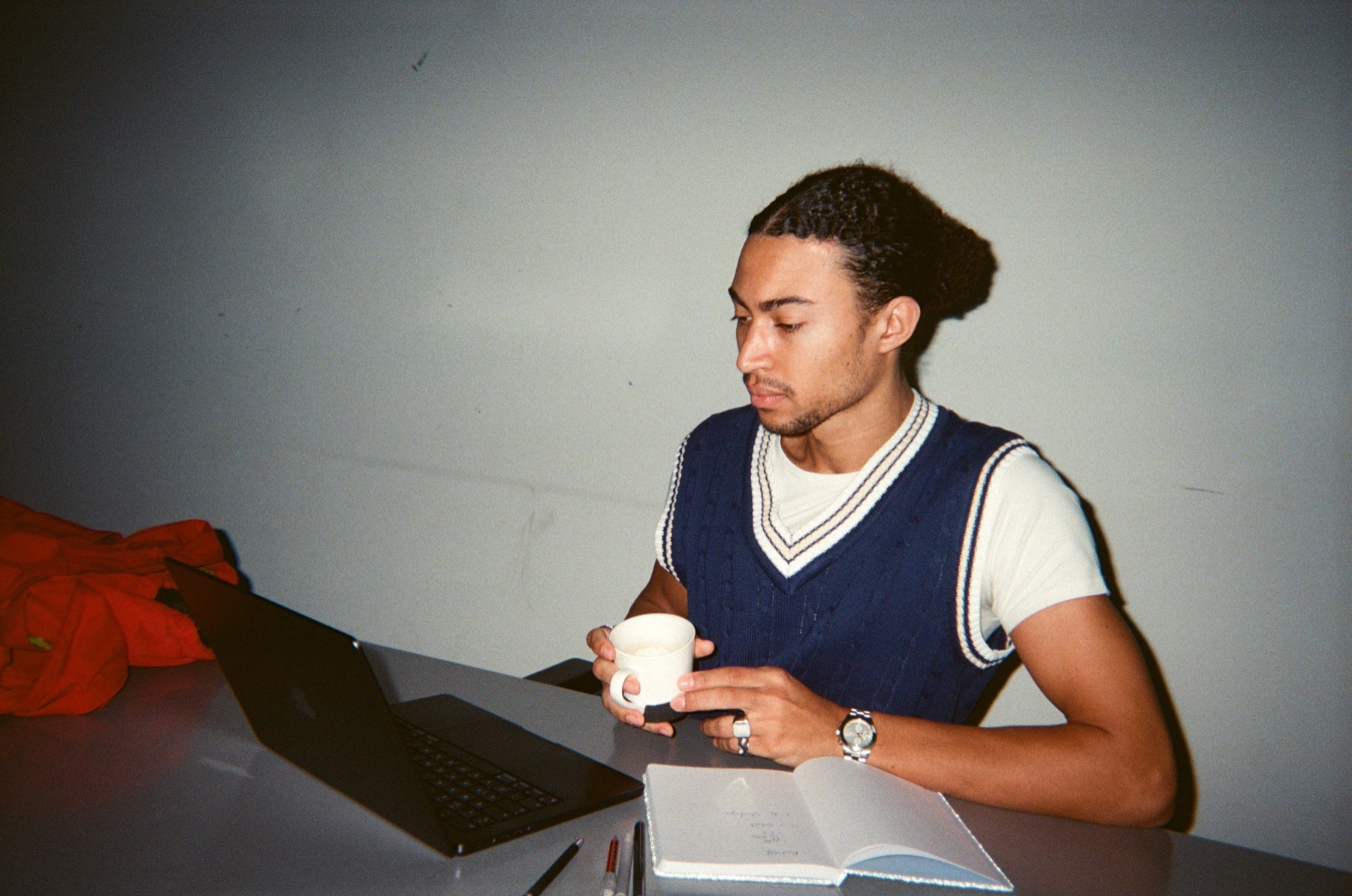 Colleague with coffee at his desk