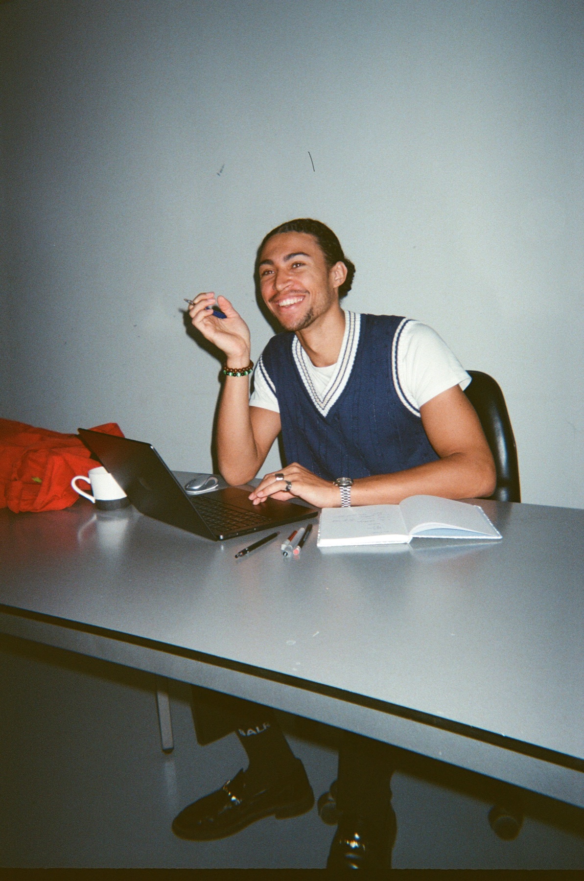 Colleague laughing at his desk