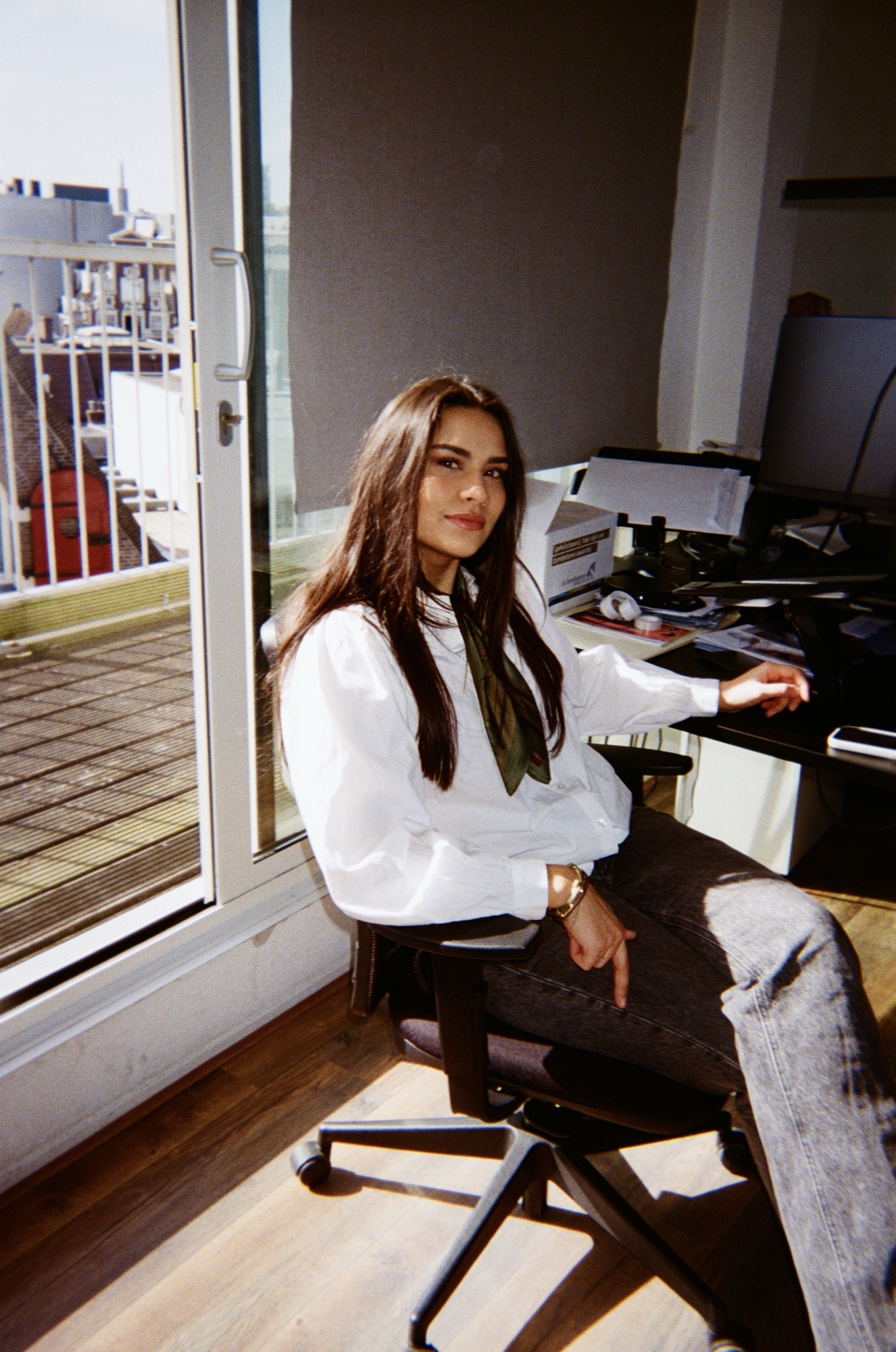 Colleague working at her desk by the window