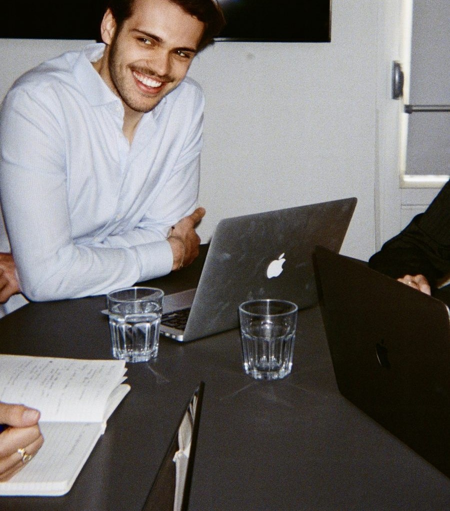 A colleague laughing during a meeting