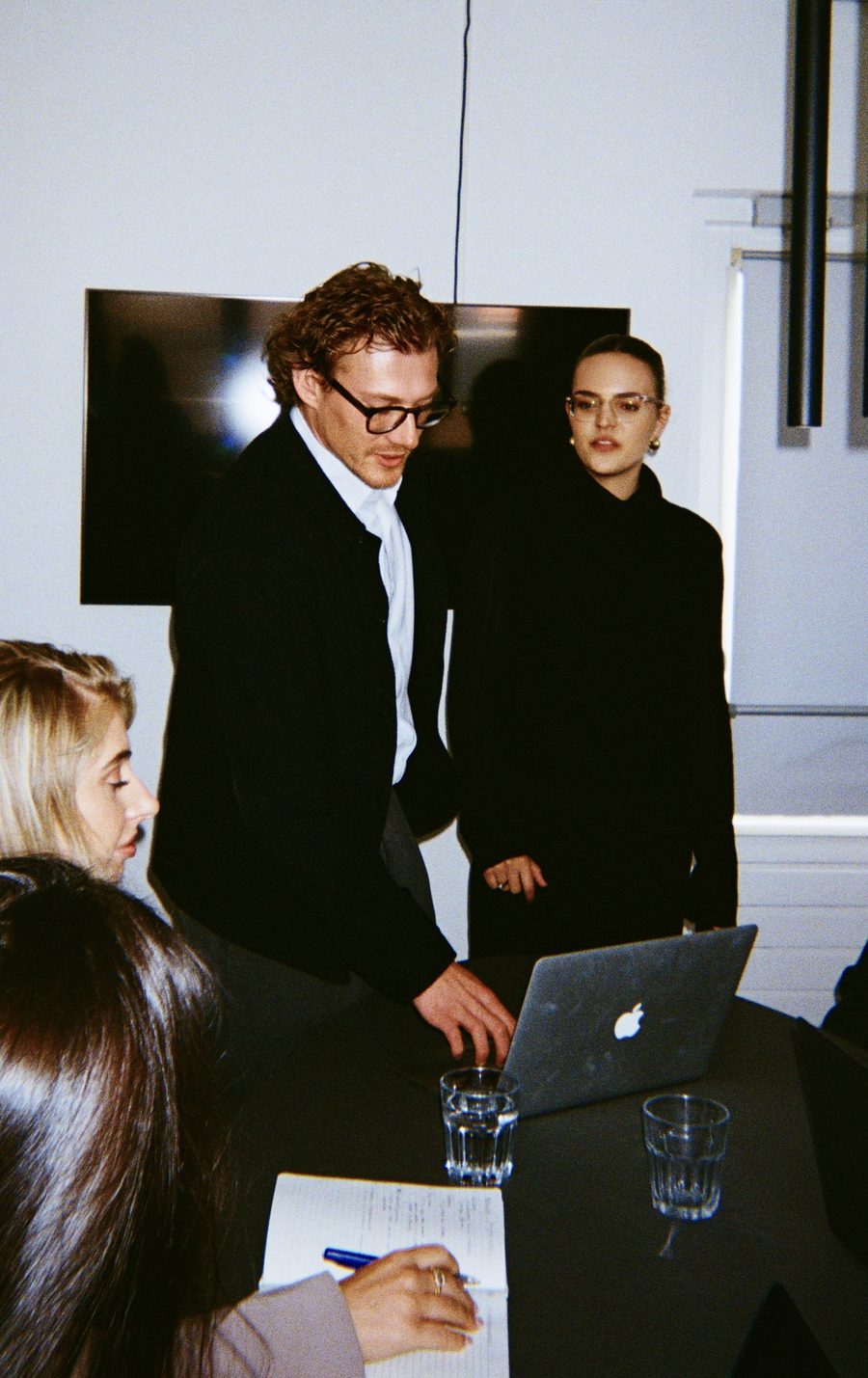 Colleagues looking along on the laptop